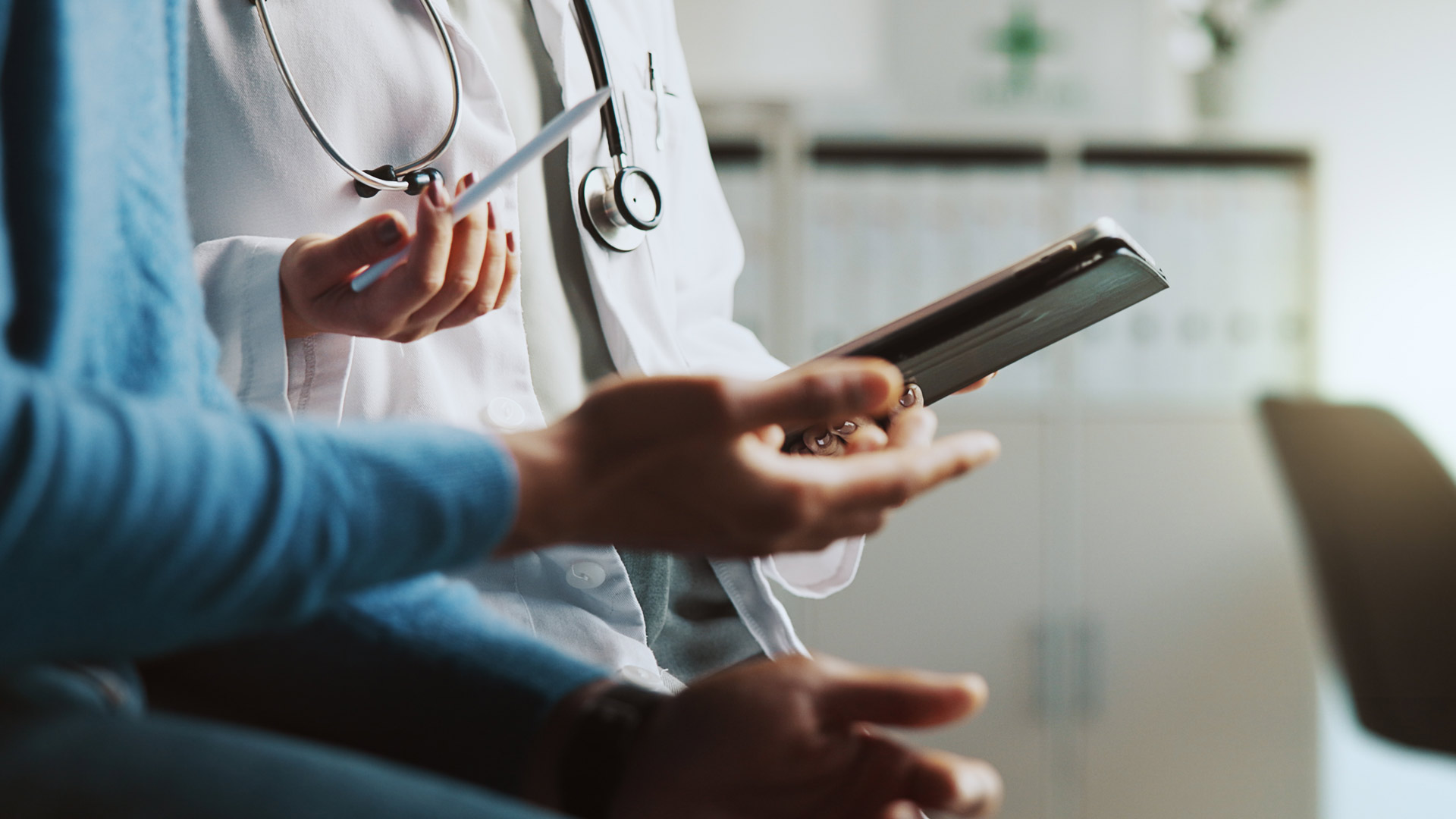 Hands, doctor and patient with tablet, online results and conversation with feedback for diagnosis. People, closeup and medical insurance with professional, man and tech with stylus and consultation, m3mi, rare diseases